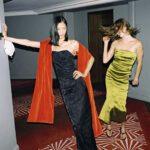 Models wearing black and green evening dresses in NET-A-PORTER holiday campaign
