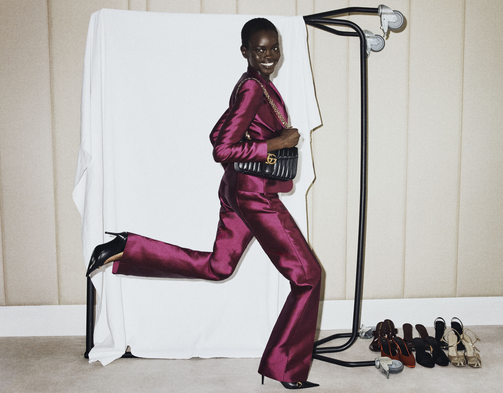 Model in a magenta suit in the NET-A-PORTER holiday campaign