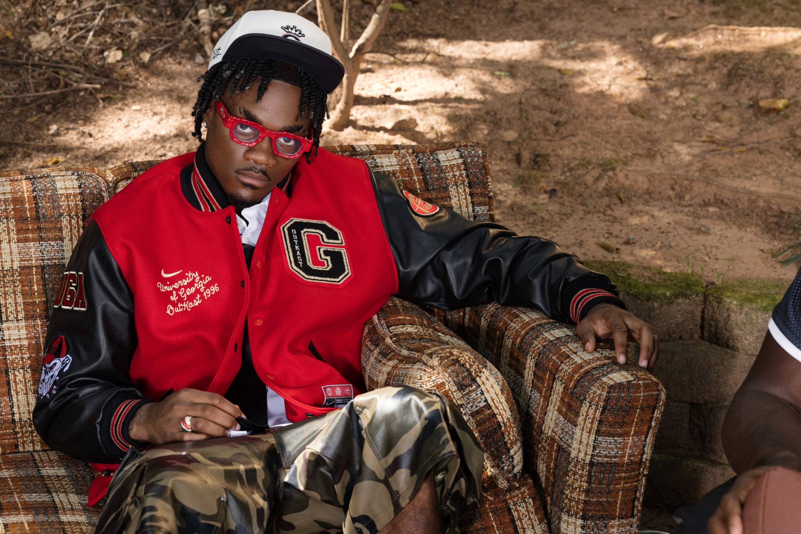 Nike NIL athlete wearing the red Georgia x Outkast varsity jacket