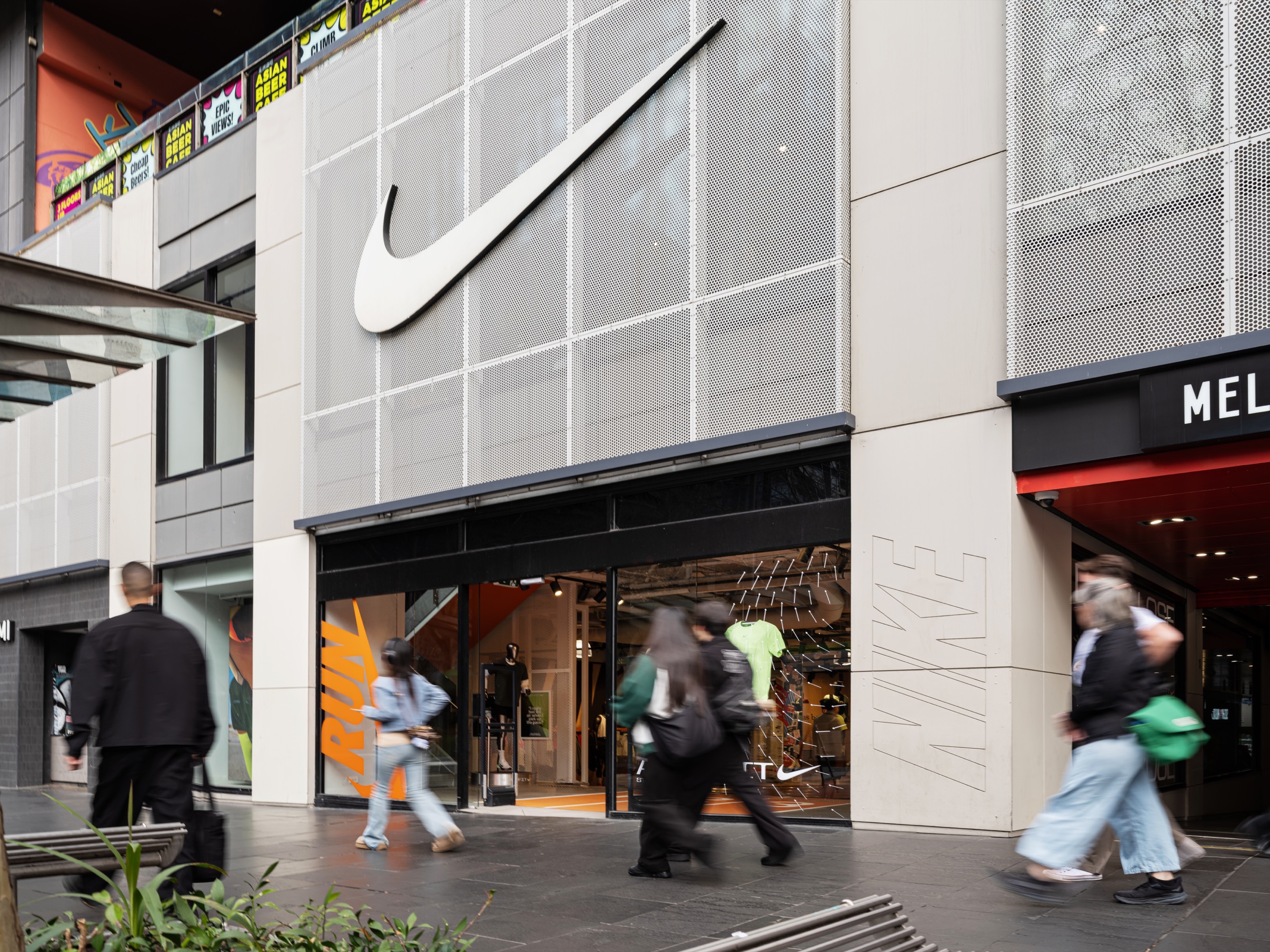 Nike Melbourne Central storefront with a large Nike Swoosh above the entrance.