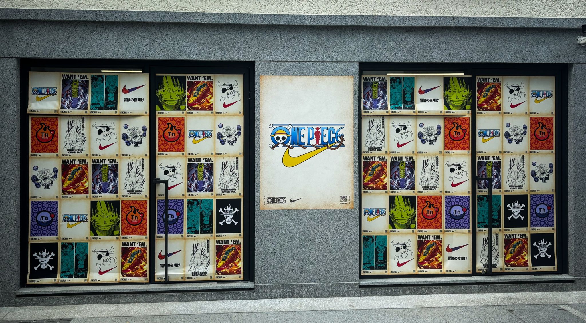 Nike x ONE PIECE posters across a Tokyo storefront