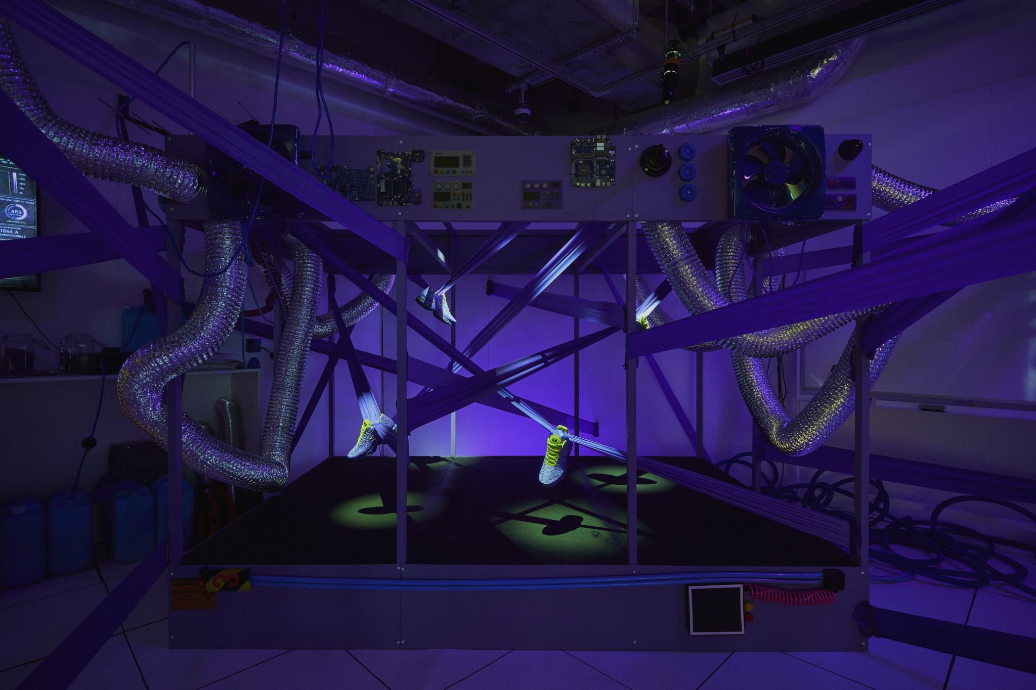Nike x ONE PIECE footwear suspended in a themed lab installation