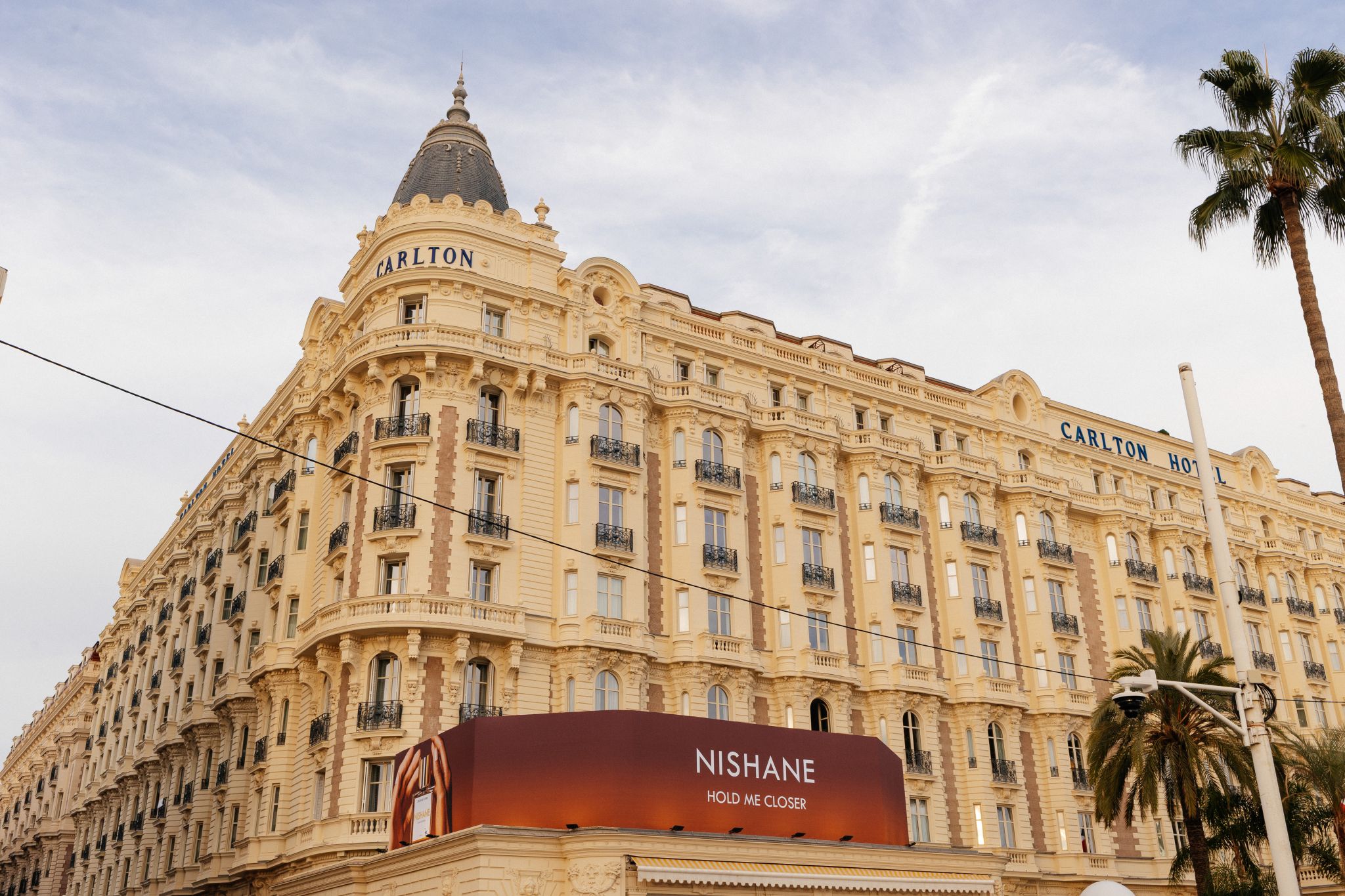 Carlton hotel in Cannes with NISHANE Hold Me Closer display
