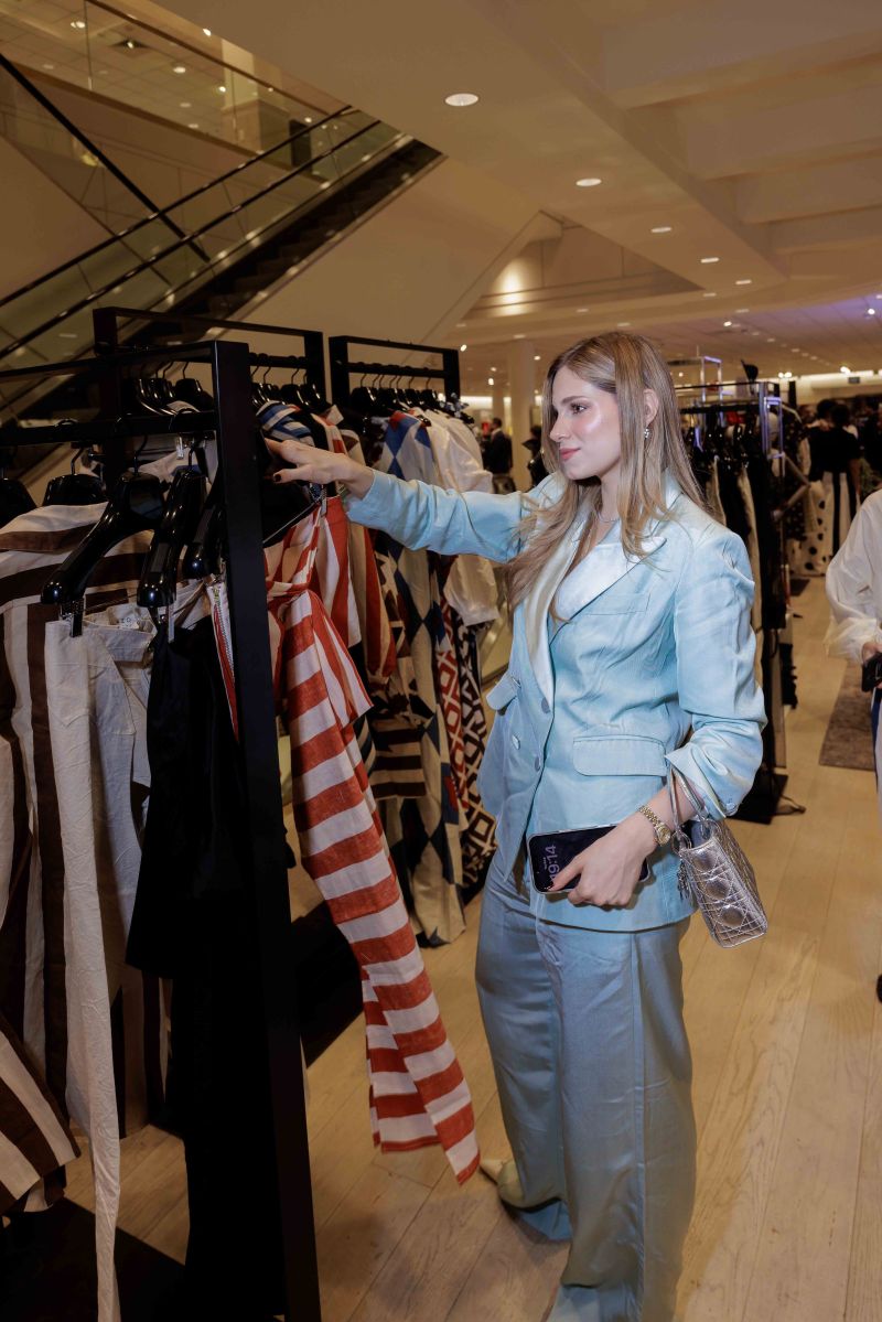Fashion presentation beside clothing racks at Nordstrom Merrick Park