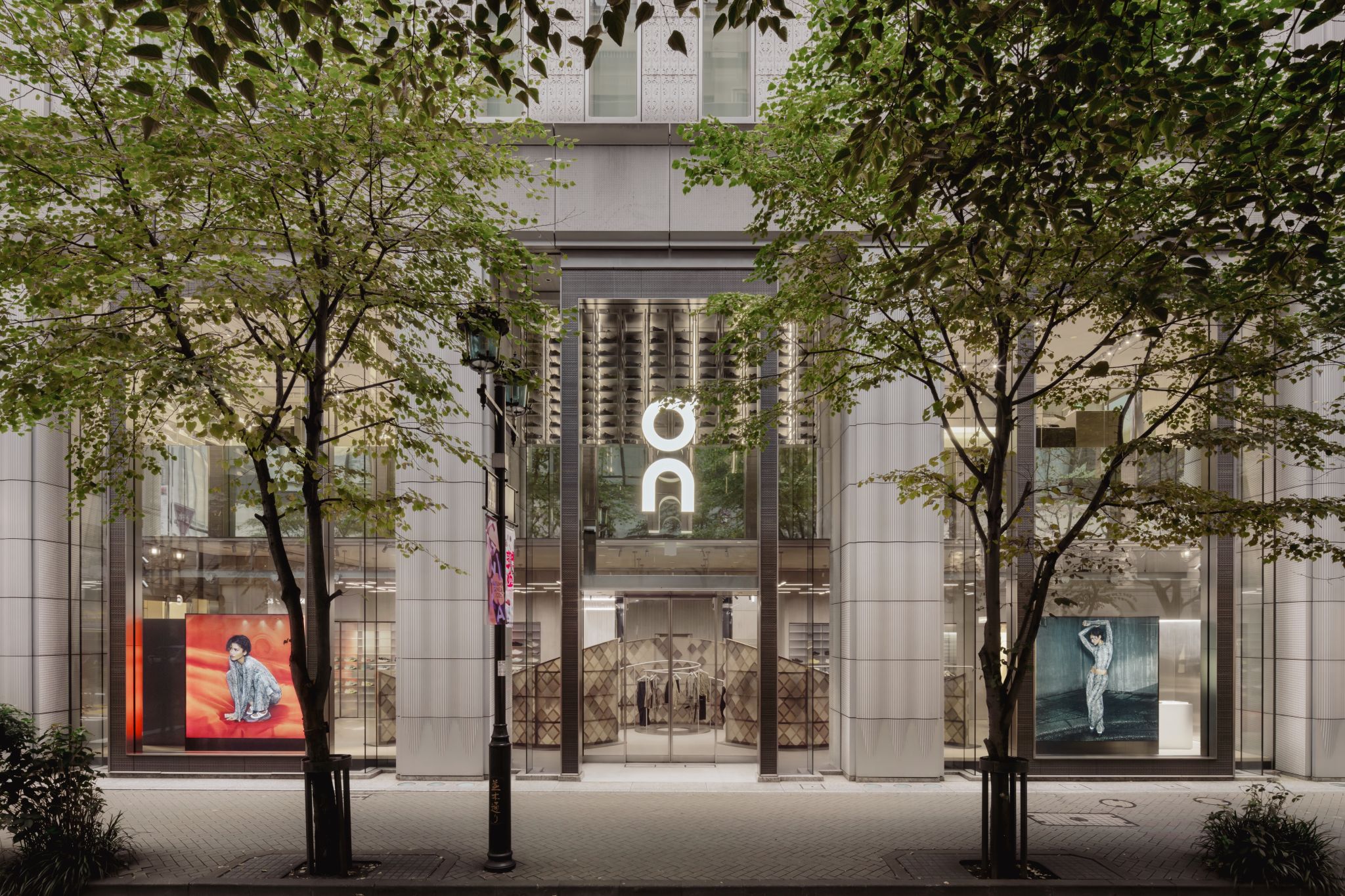 Exterior of an On flagship store displaying the Zendaya collection campaign in its windows