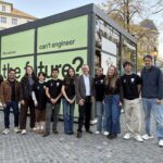 On InCube team outside the glass cube at Hechtplatz in Zurich
