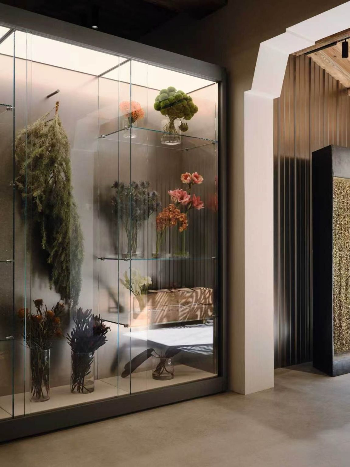 Artwork, planting and curtains within the Our Legacy Shanghai store