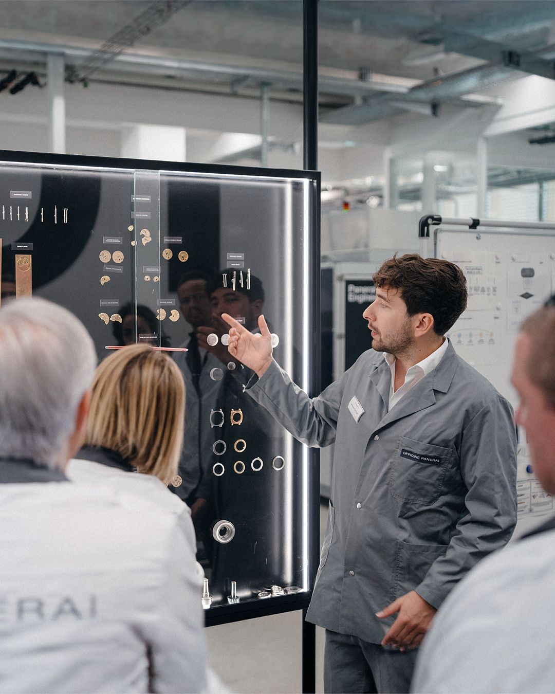 Visitors observe a technical demonstration at the Panerai manufacture