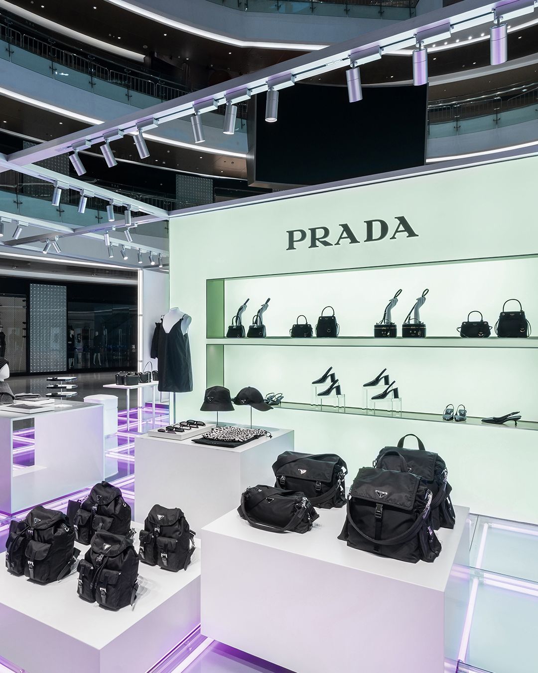 Black Prada bags and accessories displayed inside the Hangzhou Essence pop-up