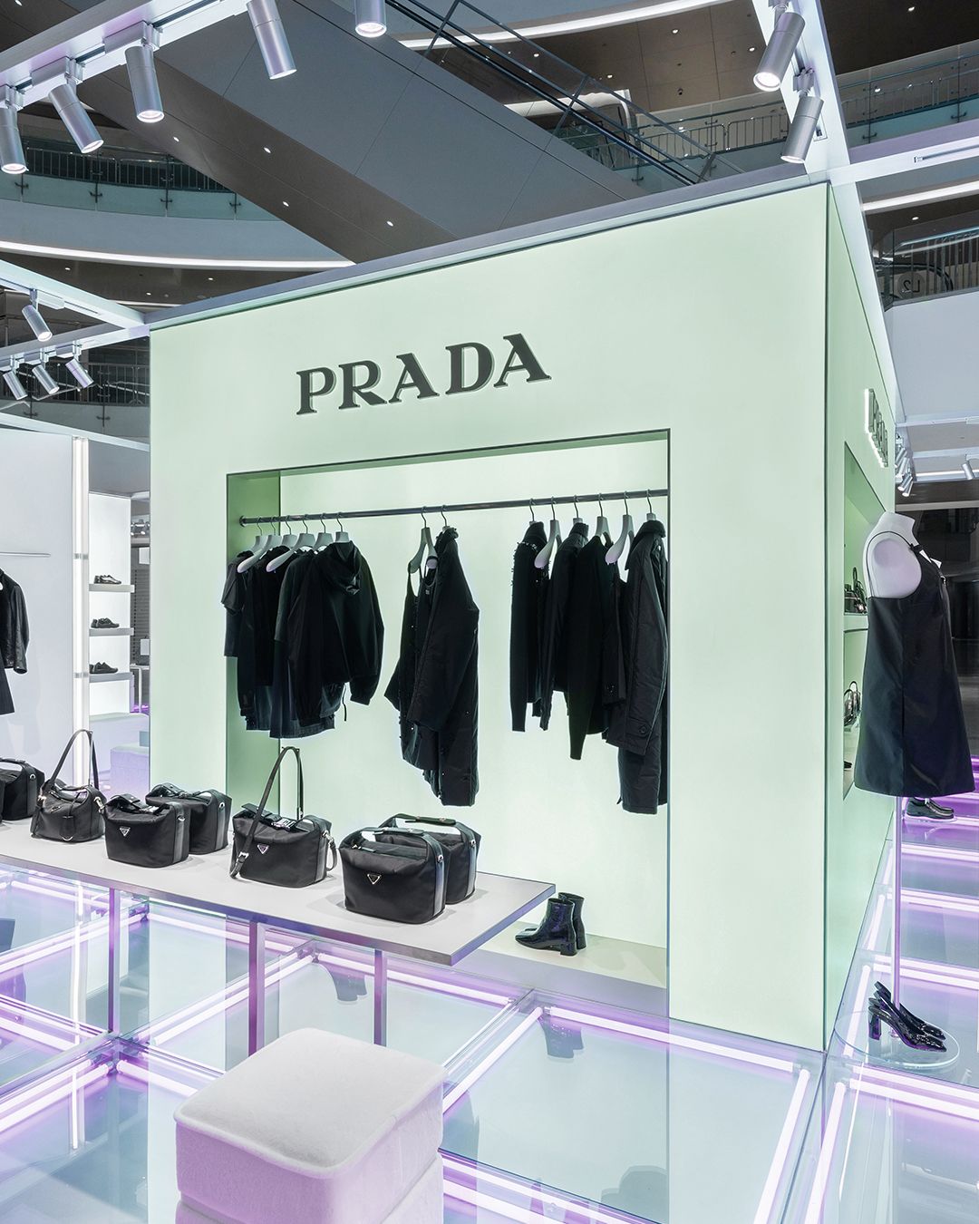 Black apparel and bags inside the Prada Essence Hangzhou pop-up