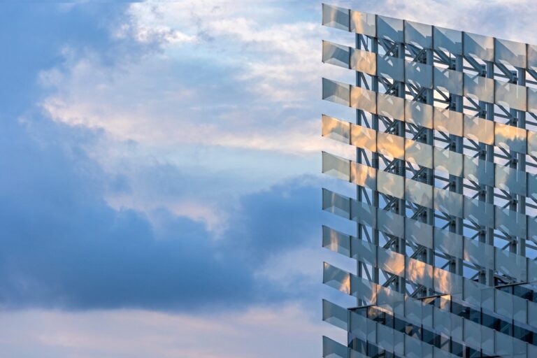 Reflective geometric building facade pictured in Puig’s third-quarter results announcement.