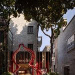 Qeelin House Shanghai Xintiandi entrance framed by a red Wulu-inspired installation
