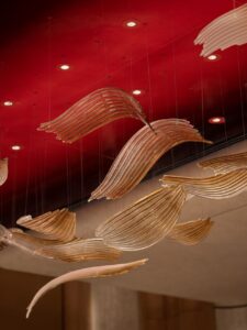 Sculptural ceiling lighting above the red interior of Qeelin House Shanghai Xintiandi