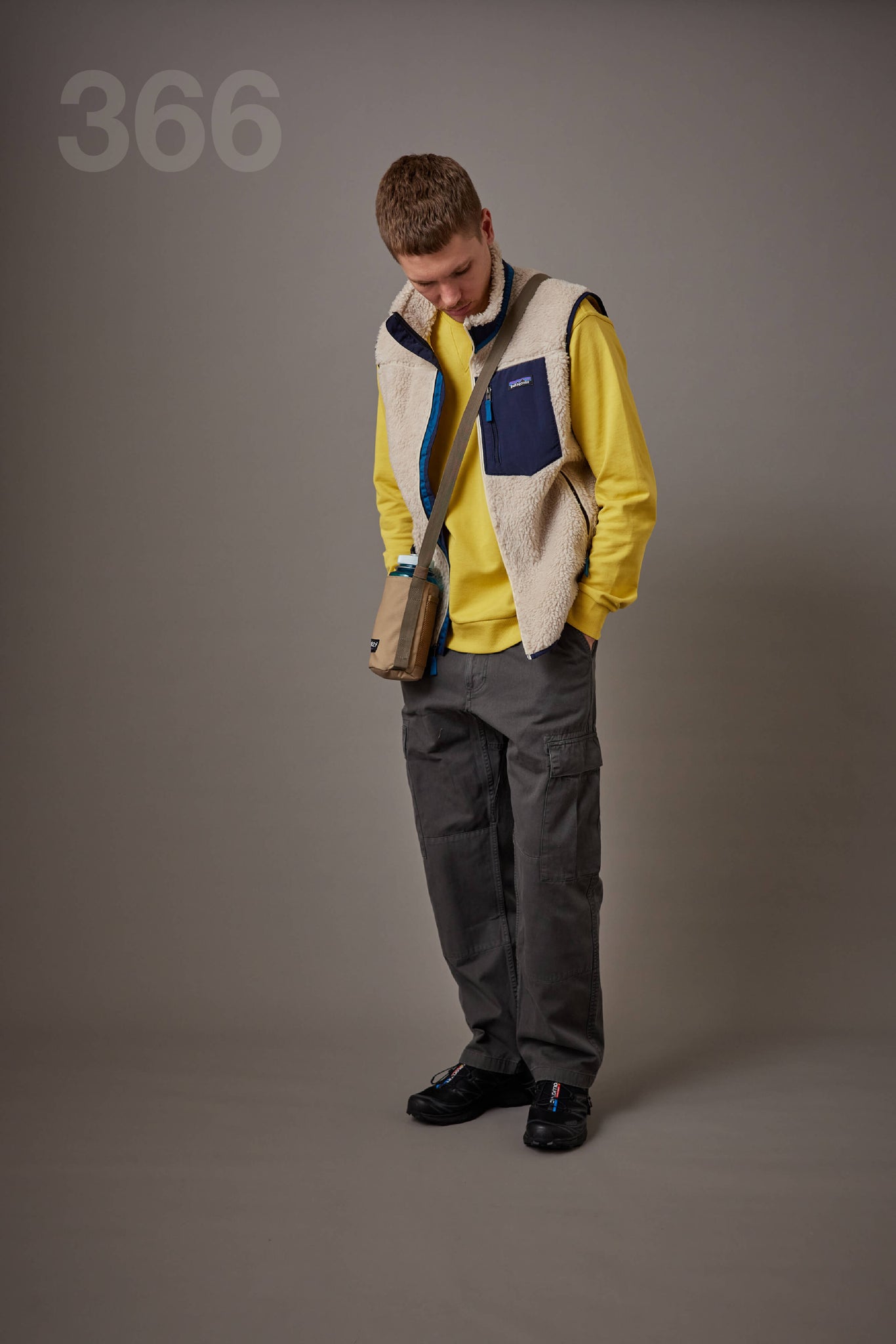 Maplestore outfit combining a Patagonia fleece vest, Gramicci cargo pants and Salomon trail-style shoes