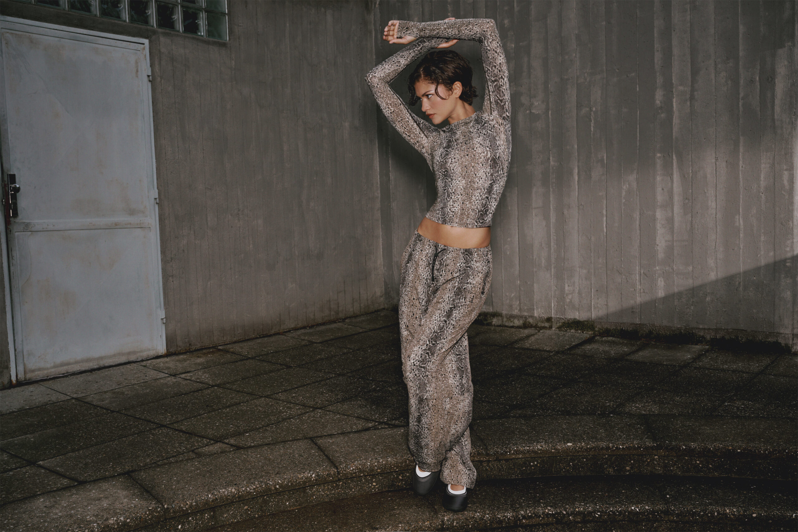 Zendaya wearing a python-print outfit and Cloudnova Moon shoes in the On FW26 campaign