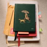 Illustrated green notebook from the Burberry and Smythson collaboration.