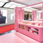 Pink Rhode display with integrated product shelves