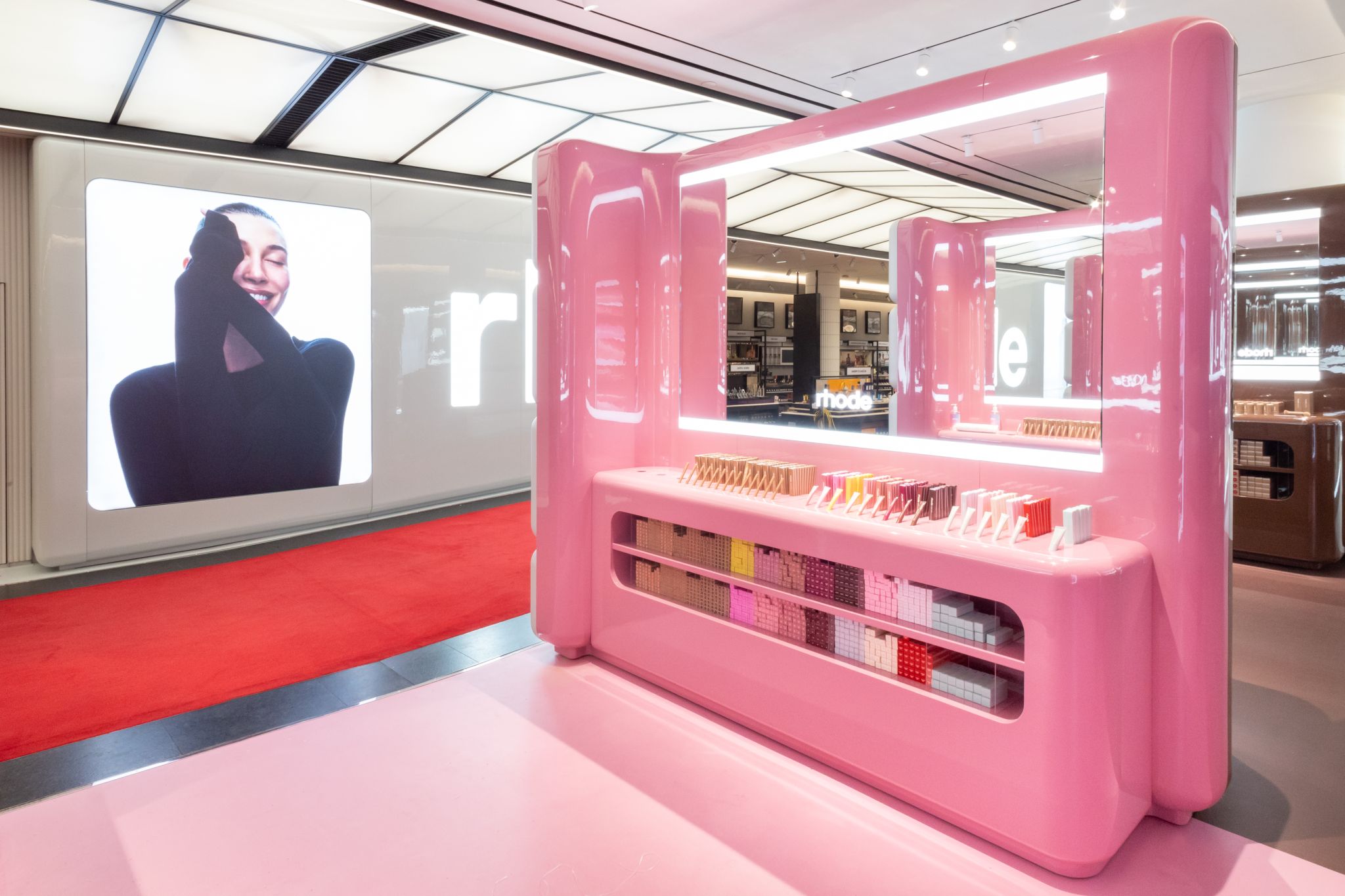 Pink Rhode display with integrated product shelves