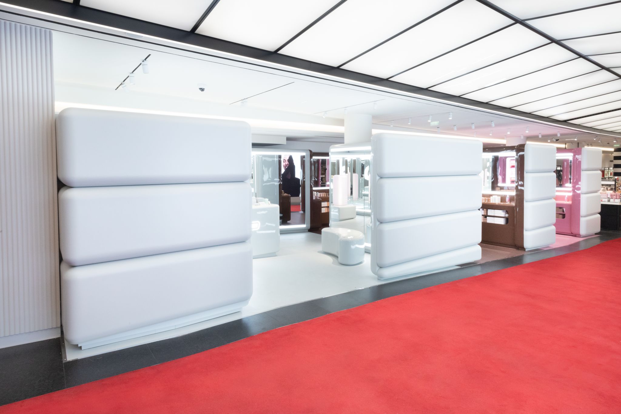 Pale rounded Rhode installation structures inside Sephora