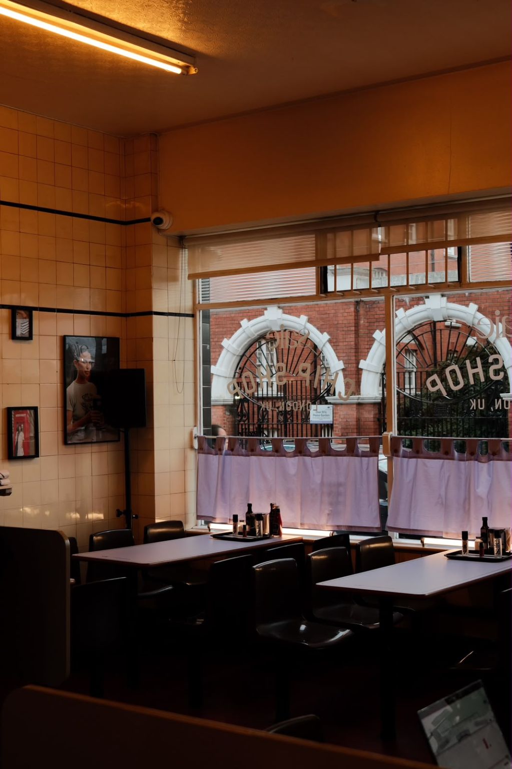 Lilac bistro curtains and Saie product trays inside the Regency Cafe