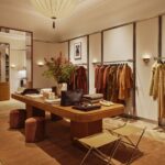 Merchandise tables and clothing rails in Sézane’s Upper East Side store