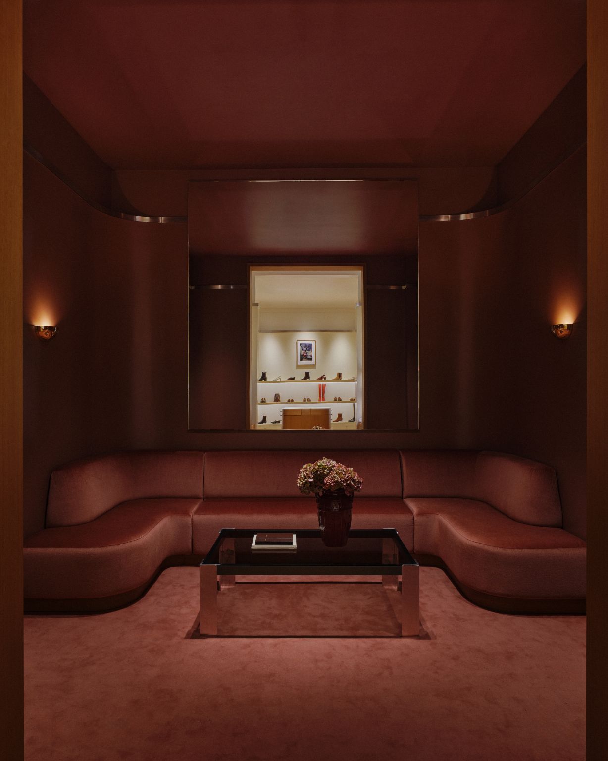 Deep-red seating room inside Sézane’s Madison Avenue Appartement