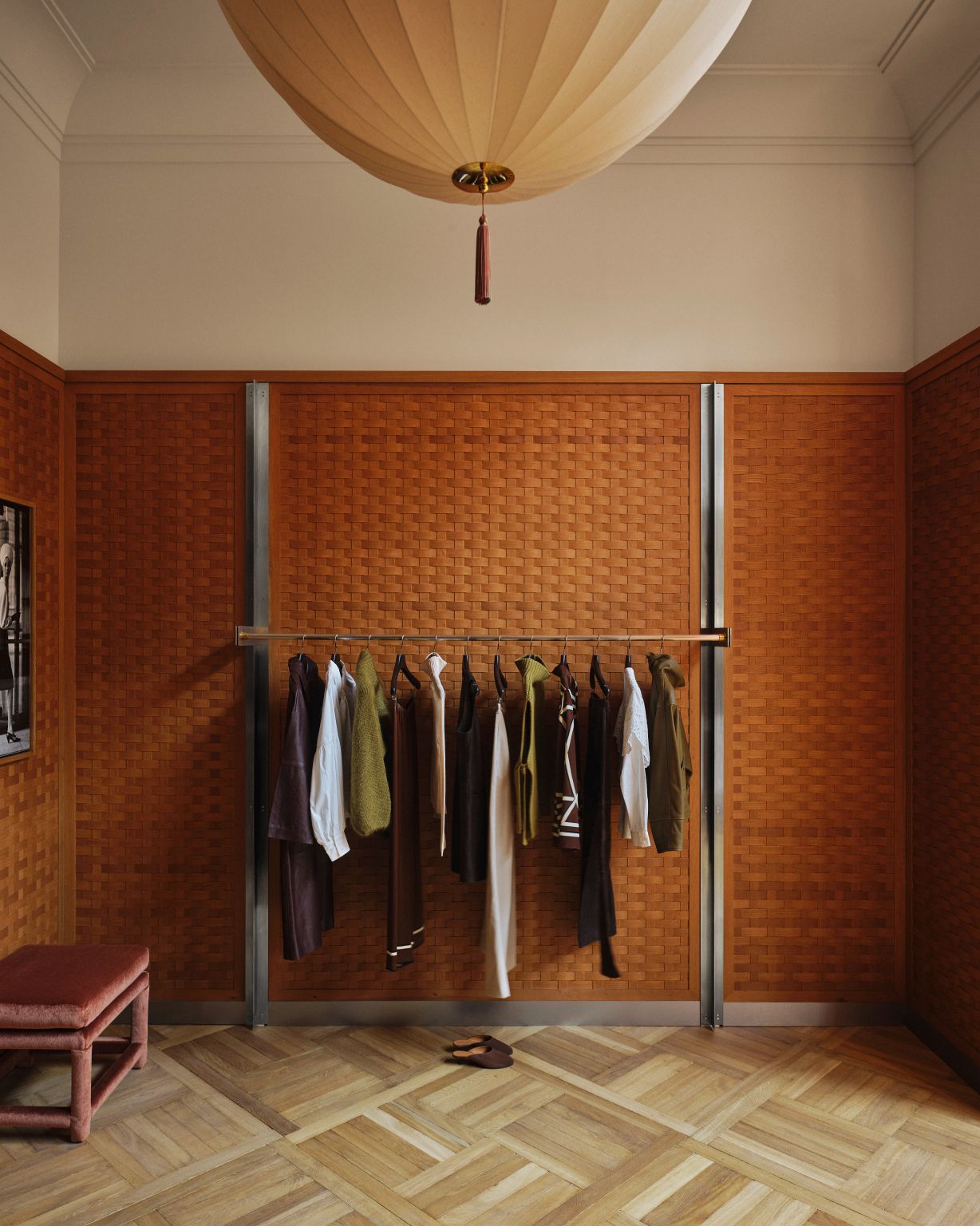 Clothing rail, parquet flooring and pendant light at Sézane Madison Avenue