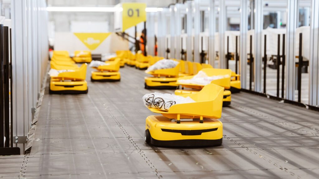 Yellow automated sorting equipment inside the SHEIN Canada warehouse