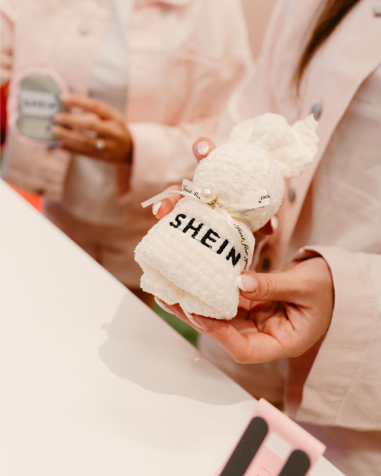 SHEIN-branded accessories displayed at the campus activation