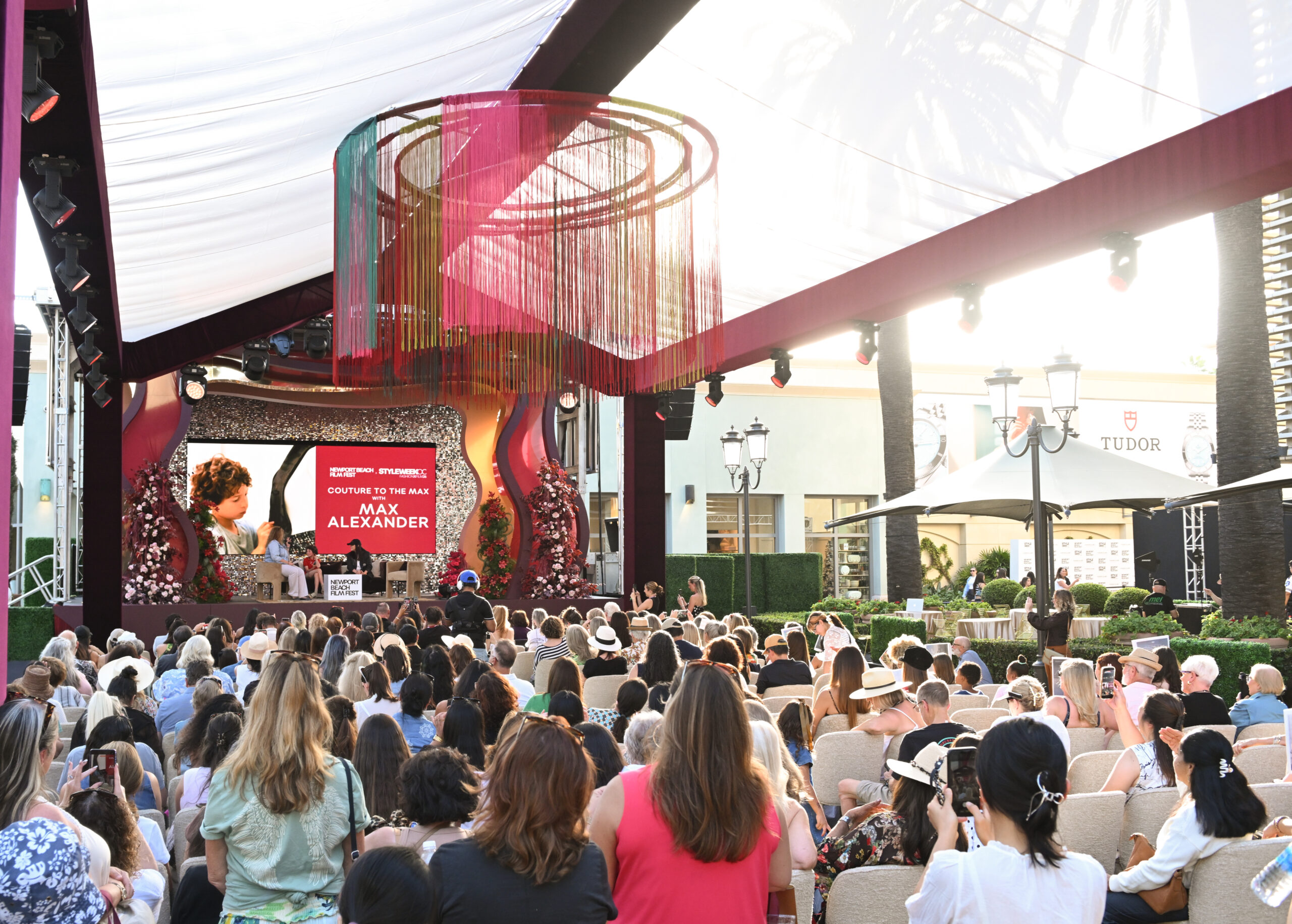 Wide audience and stage view of the Couture to the Max discussion with Melanie Miller, Max Alexander and Dori Berinstein at StyleWeekOC on October 17, 2026