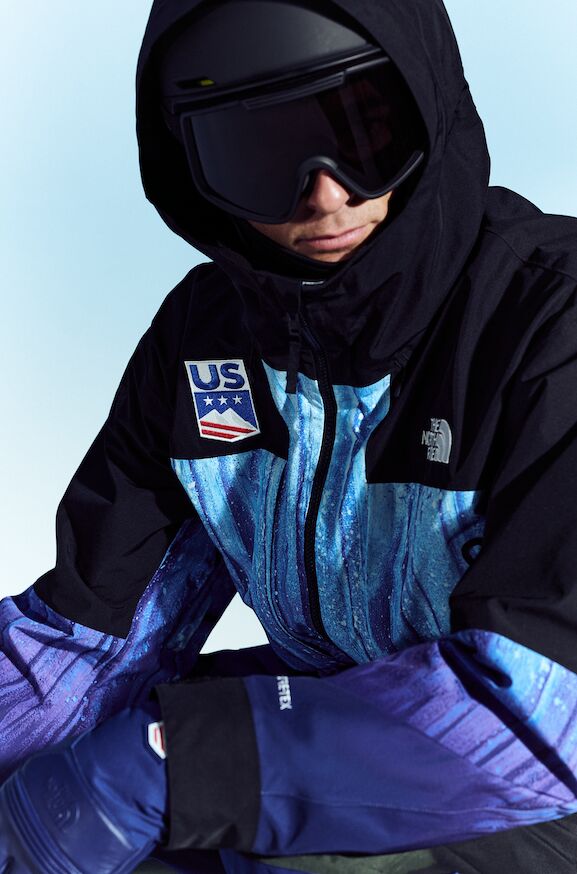 Model wearing a blue and purple The North Face U.S. Ski & Snowboard hooded kit