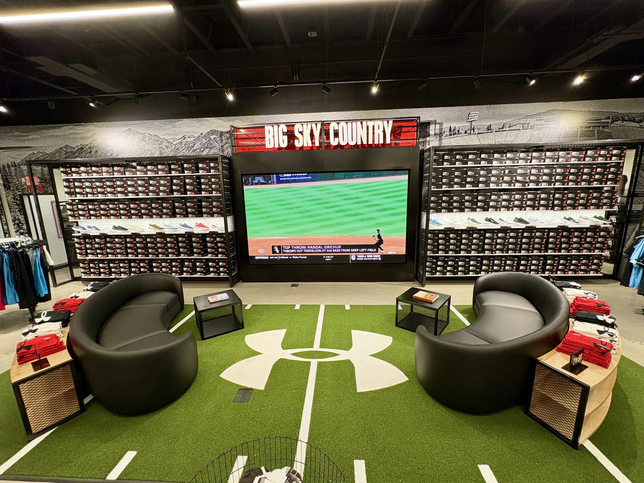 Big Sky Country footwear wall and lounge area inside Under Armour’s Bozeman Sports House