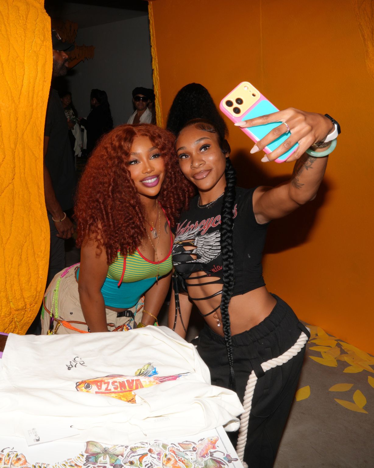 SZA posing for a photograph with an attendee