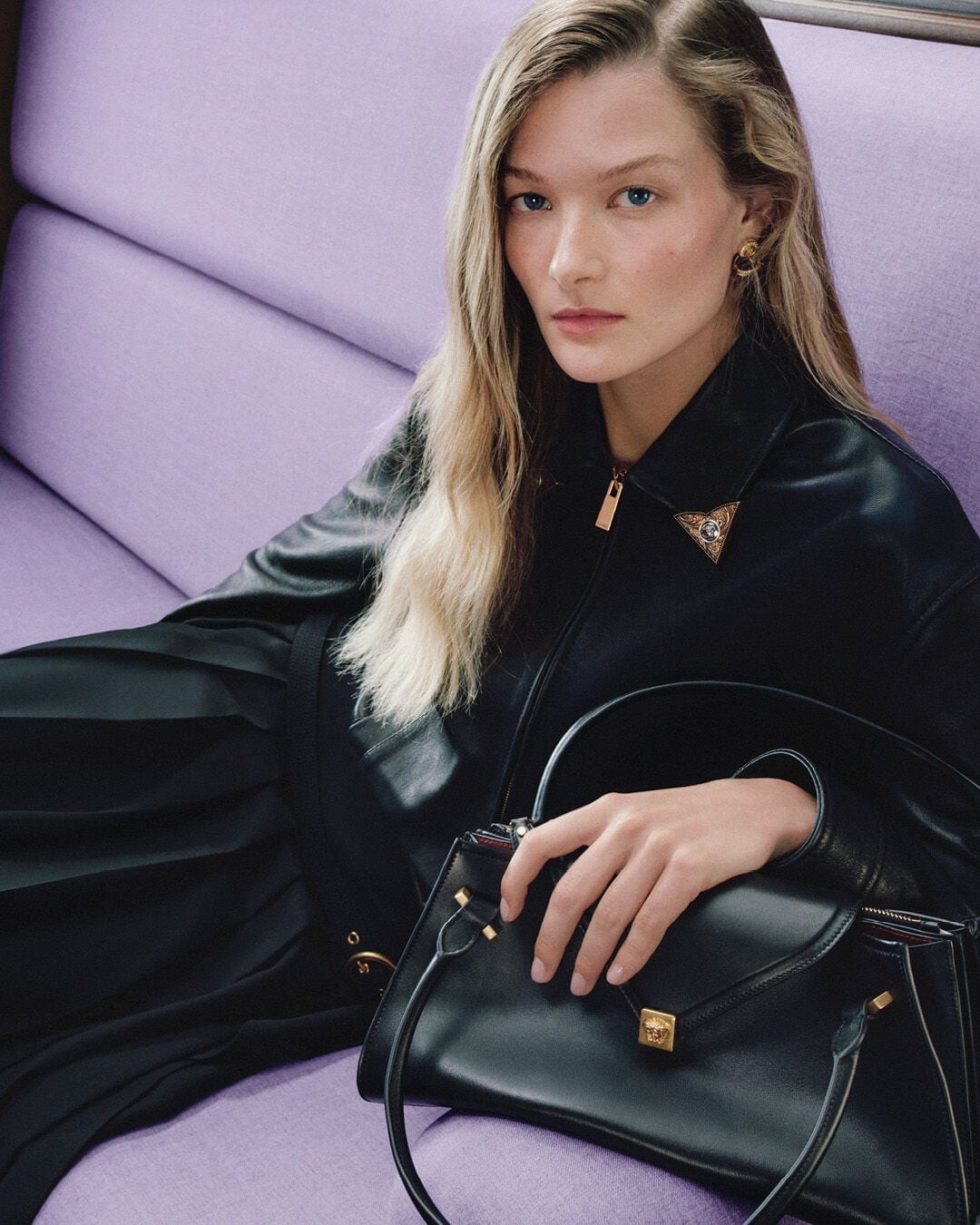 Versace holiday campaign portrait in a lavender train seat