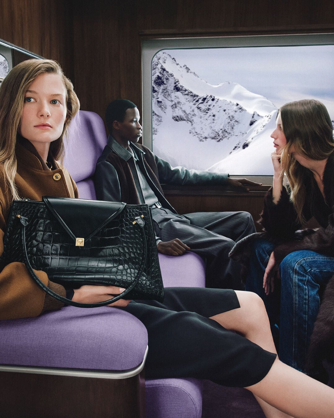 Versace holiday handbags and passengers inside a train carriage