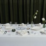 Westwing and Victoria Beckham dining collection arranged on a white tablecloth