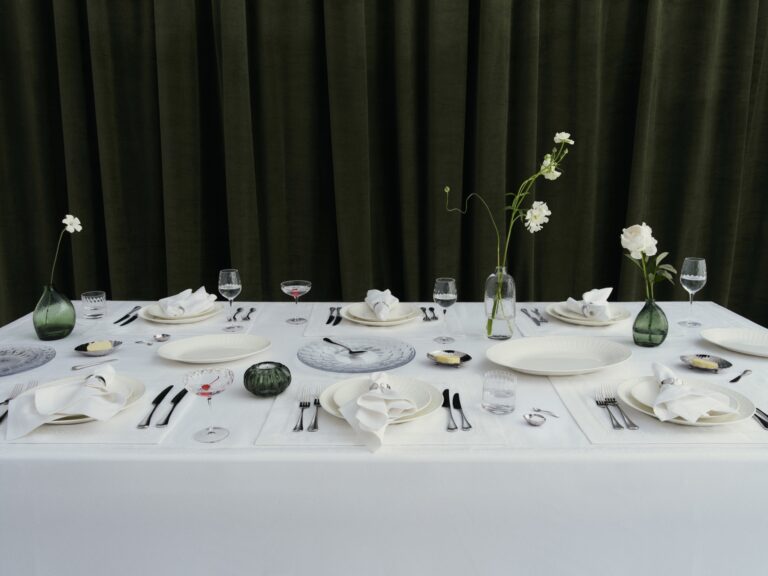 Westwing and Victoria Beckham dining collection arranged on a white tablecloth