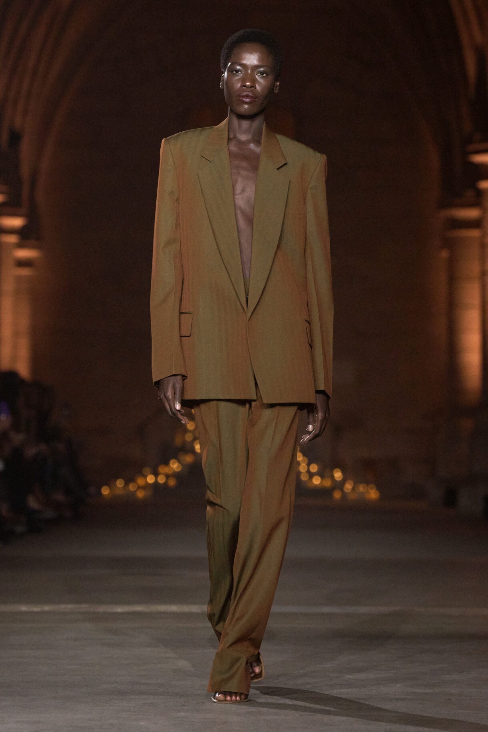 Model in olive tailoring at the Victoria Beckham Spring Summer 2027 runway show