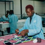 Artisan works on patterned accessories for Vivienne Westwood in Kenya
