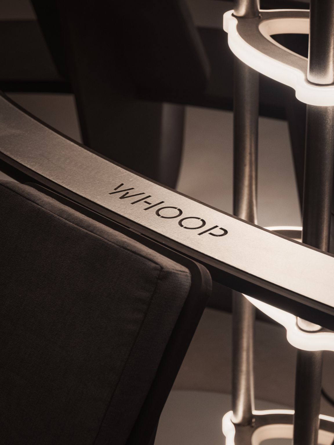 Detail of WHOOP branding and illuminated structure at RECOVER 01
